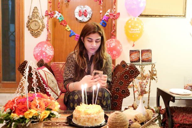 A young Pakistani girl Birthday his birthday cake at home on her birthday.